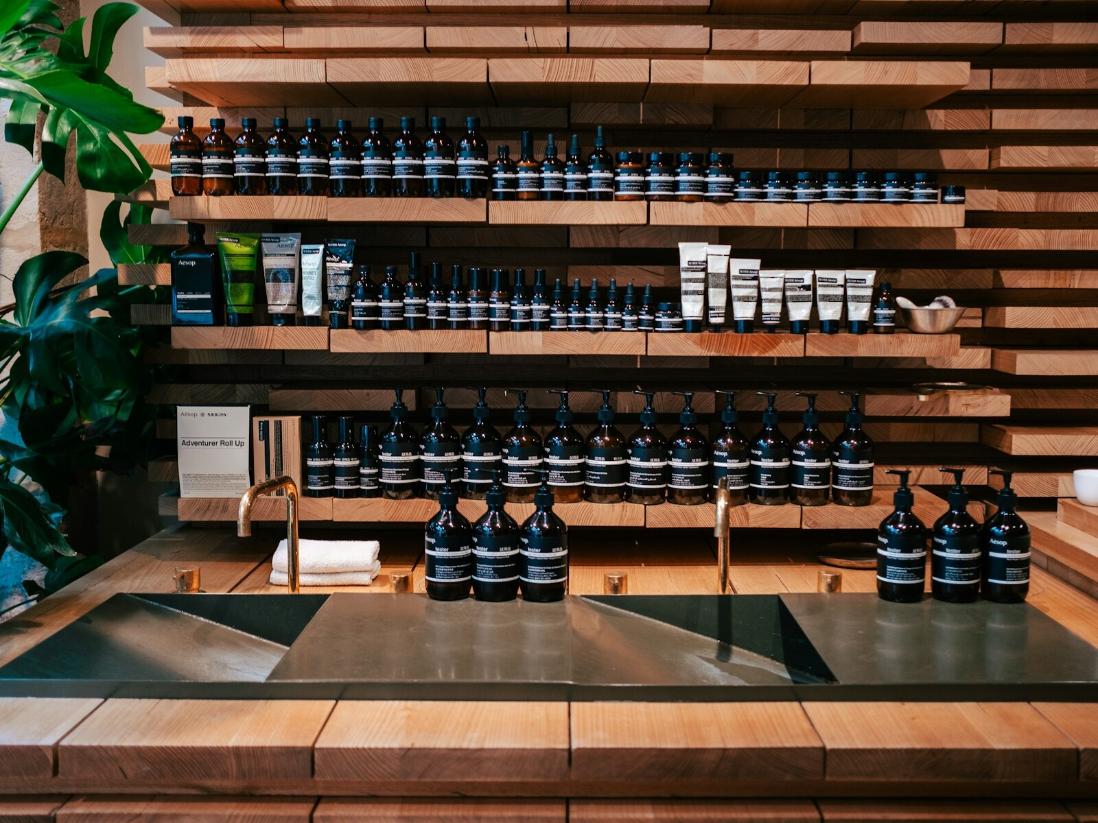 a display of bottles of wine on a wooden shelf